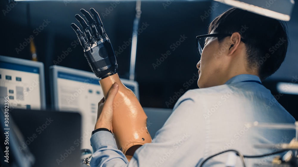 Close Up of a Futuristic Prosthetic Robot Arm Being Tested by a Professional Japanese Development En