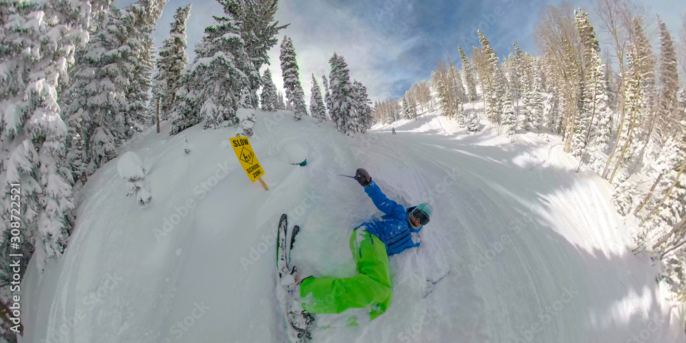 SELFIE: Beginner goes skiing off-piste and crashes right next to a yellow sign.