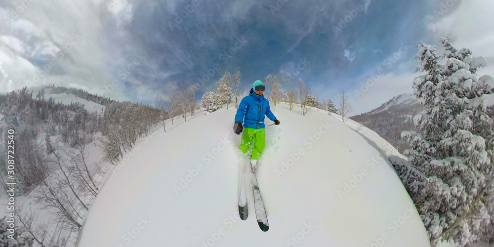 SELFIE: Freeride skier goes for a ride in the cold smoke in the backcountry.