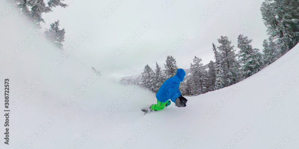 SELFIE: Overcast sky spans above man shredding freshly fallen champagne powder