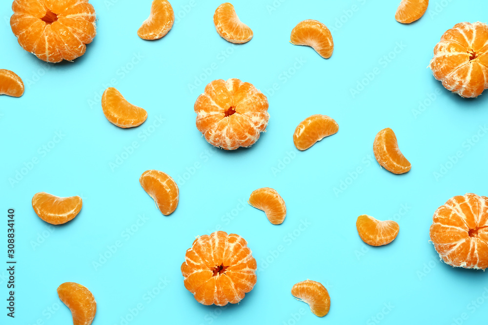 Sweet tangerines on color background