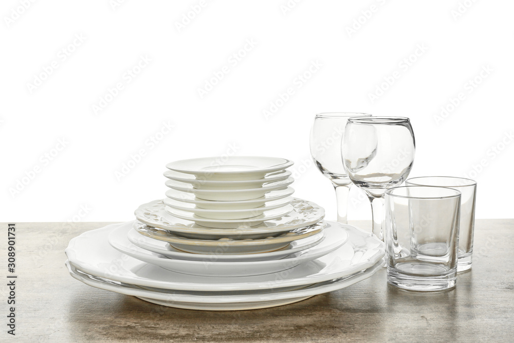 Set of clean tableware on white background