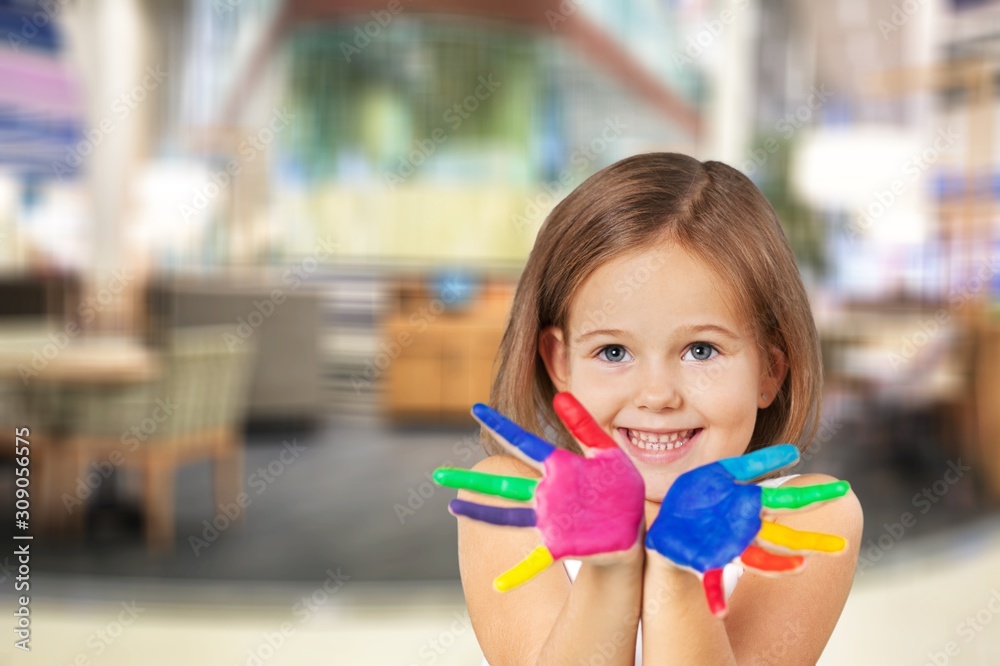 Little girl with colorful painted hands-on class background