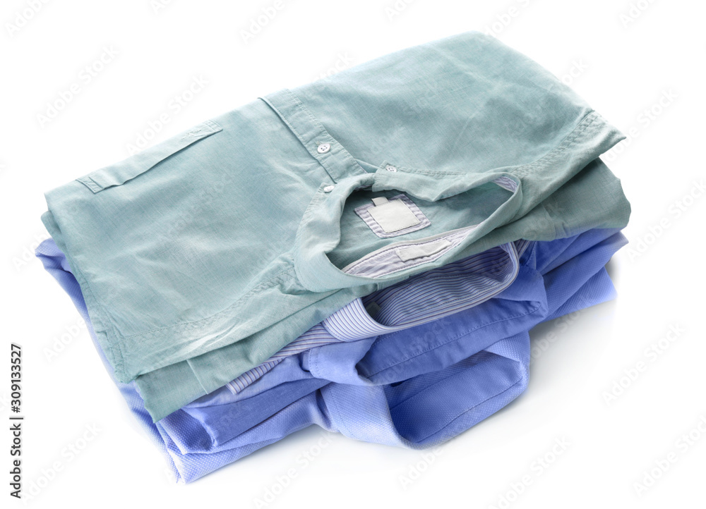 Stack of clean clothes on white background