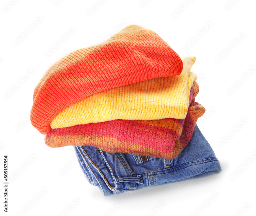 Stack of clean clothes on white background