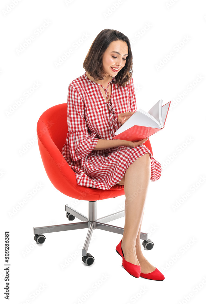 Beautiful young woman reading book on white background