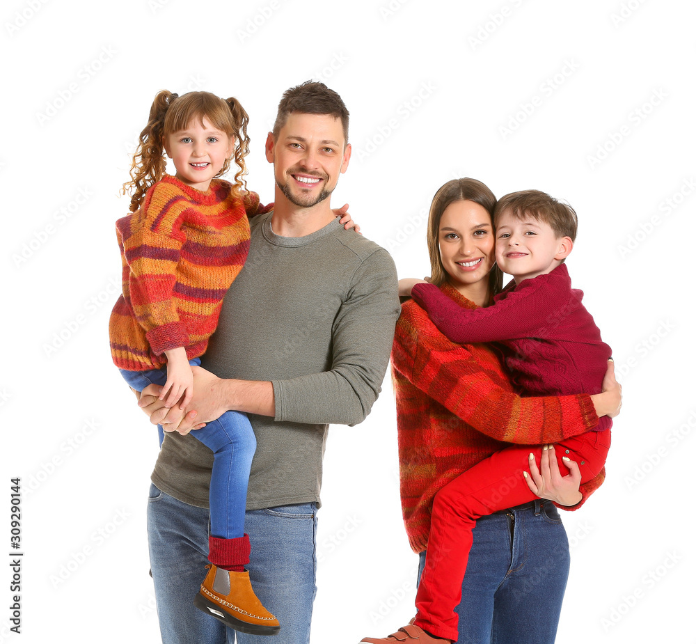 Happy family in winter clothes on white background