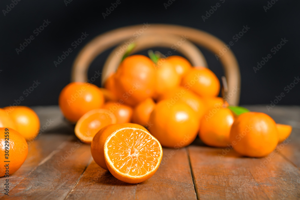 Sweet tangerines on wooden background