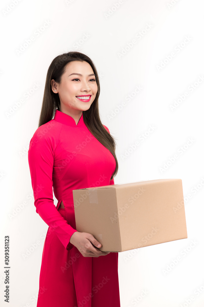 Vietnamese woman with the traditional costume holding gift box