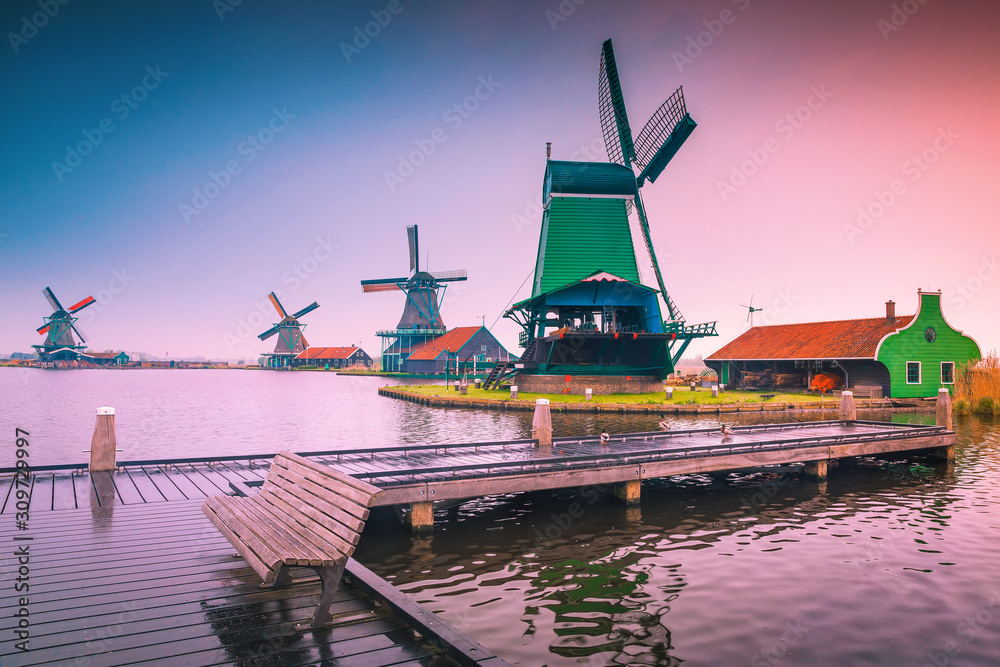 Old dutch windmills in Zaanse Schans at sunrise, Zaandam, Netherlands