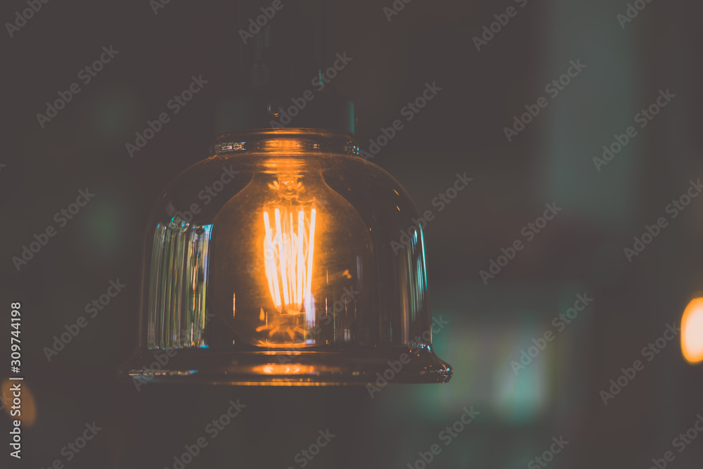 Vintage electric light.Decorative antique edison style light bulbs in coffee shop.vintage tone