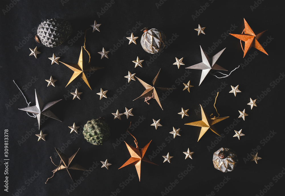 Christmas or New Year holiday texture, wallpaper and background. Flat-lay of paper toy decorative st