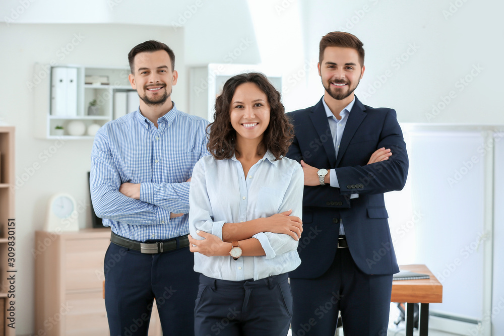 Portrait of young business people in office