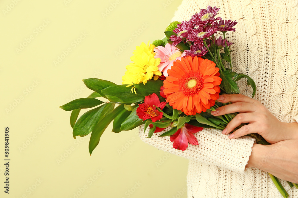 Florist with beautiful bouquet on color background