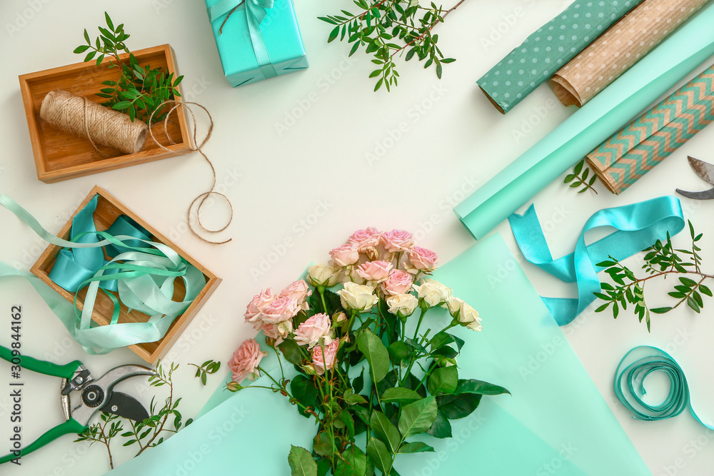 Workplace of professional florist on white background