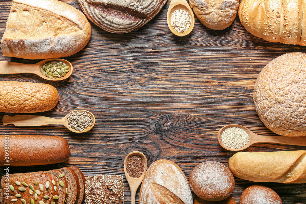 Assortment of fresh bread with seeds on table