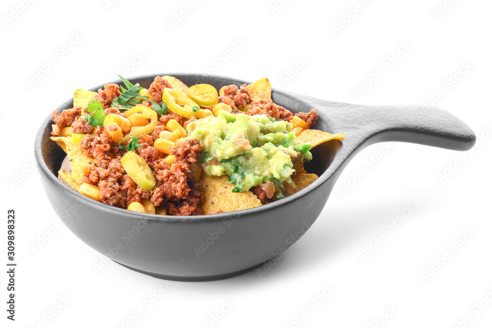 Frying pan with tasty chili con carne and nachos on white background