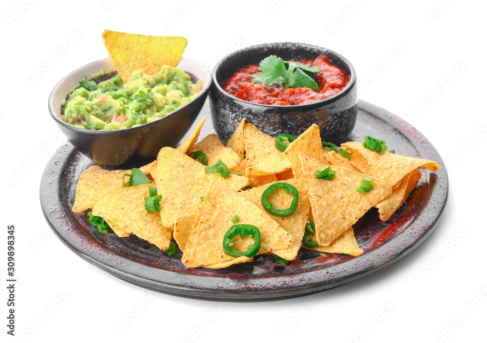 Plate with tasty nachos and sauces on white background