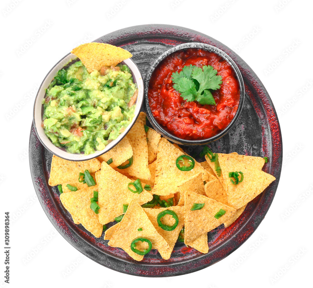 Plate with tasty nachos and sauces on white background