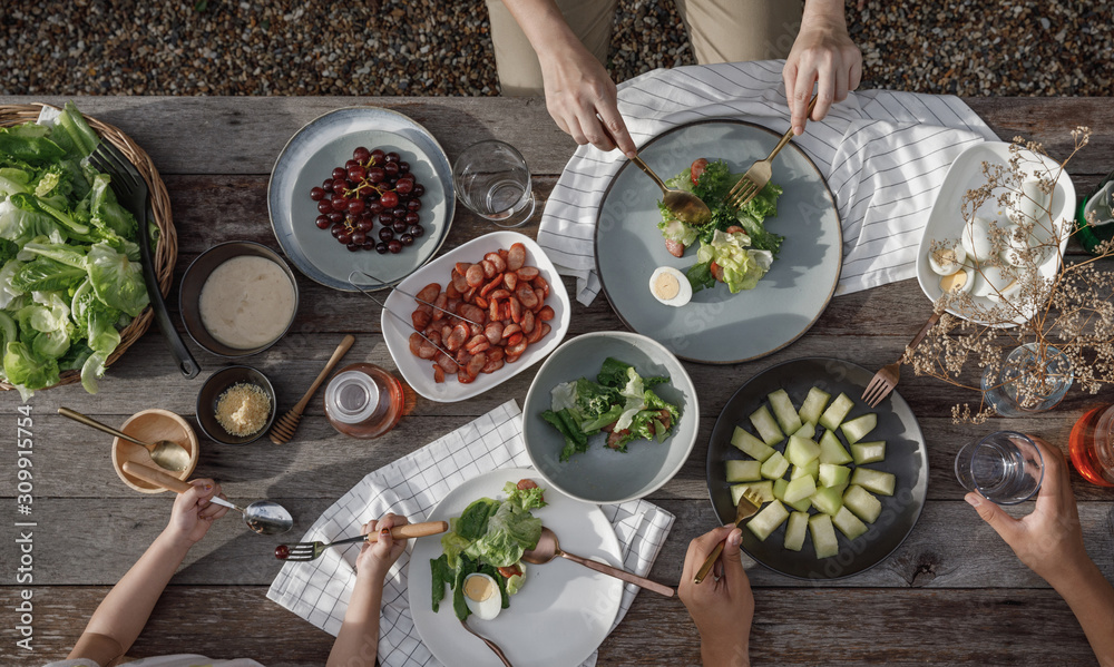 Woman and man dinner with organic salad, Food healthy organic vegetable concept with top view