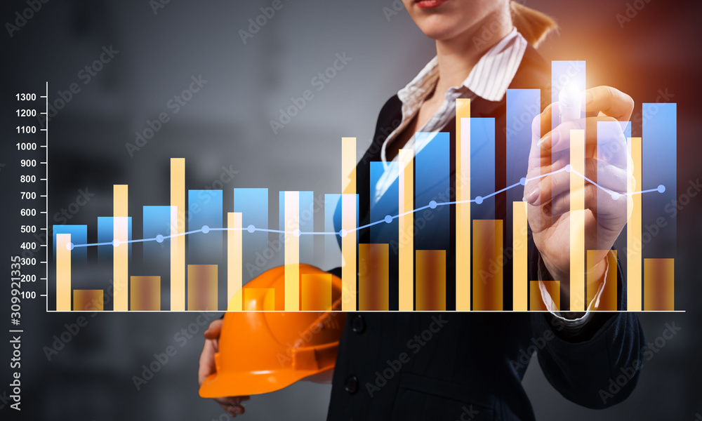 Businesswoman pointing on 3d financial chart