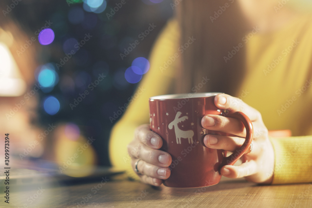 Happy woman having a tea on Christmas