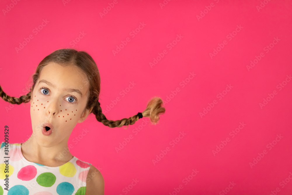 Portrait of fancy girl against pink background