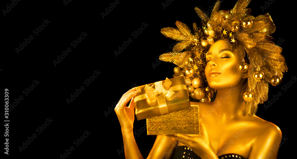 Christmas golden Woman. Winter girl receiving gift, opening magic box,  Beautiful New Year, Christma