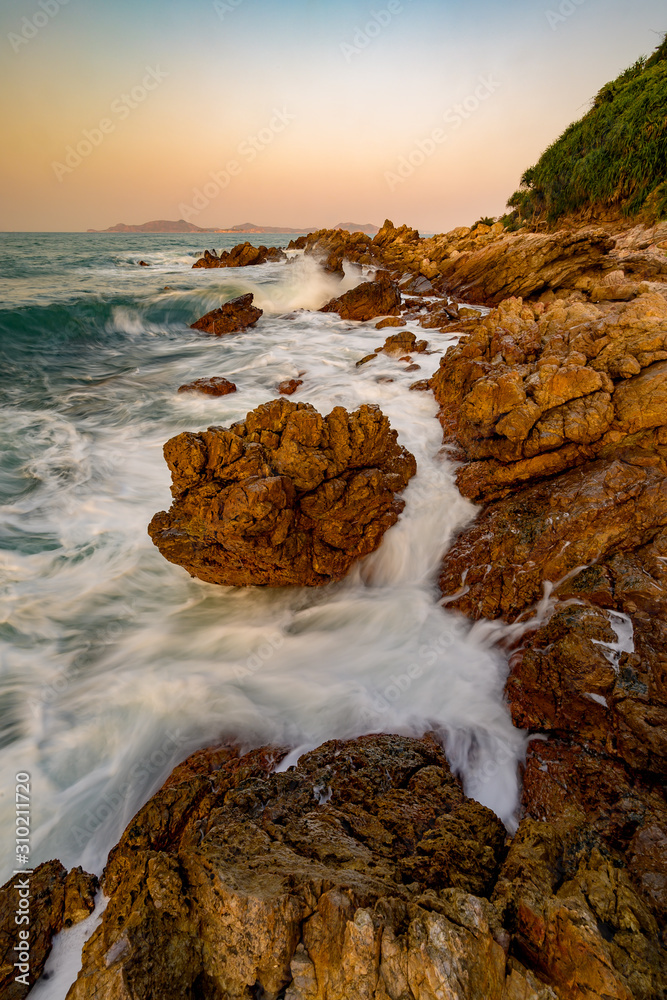 rocks at the beach in sunset