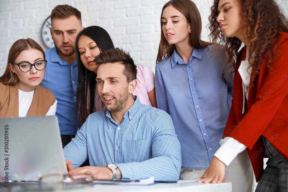 Colleagues discussing issue at business meeting in office