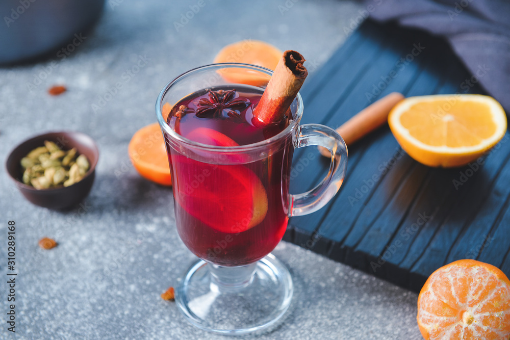 Glass cup of tasty mulled wine on table