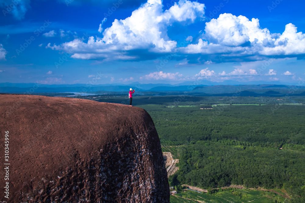 woman on top of mountains