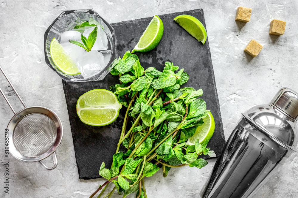 making mojito on stone background top view