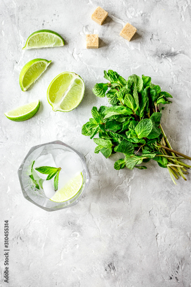 making mojito on stone background top view