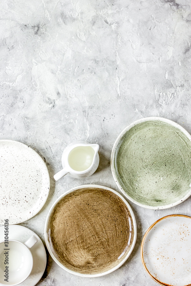 ceramic tableware top view on stone background mock up