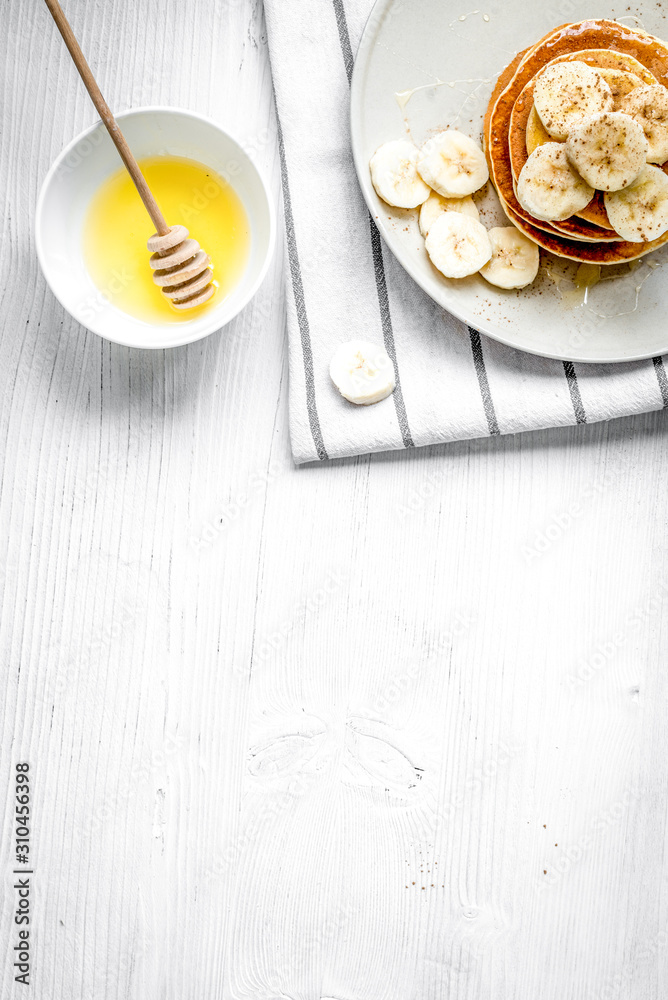 cooked pancake on plate top view at wooden background