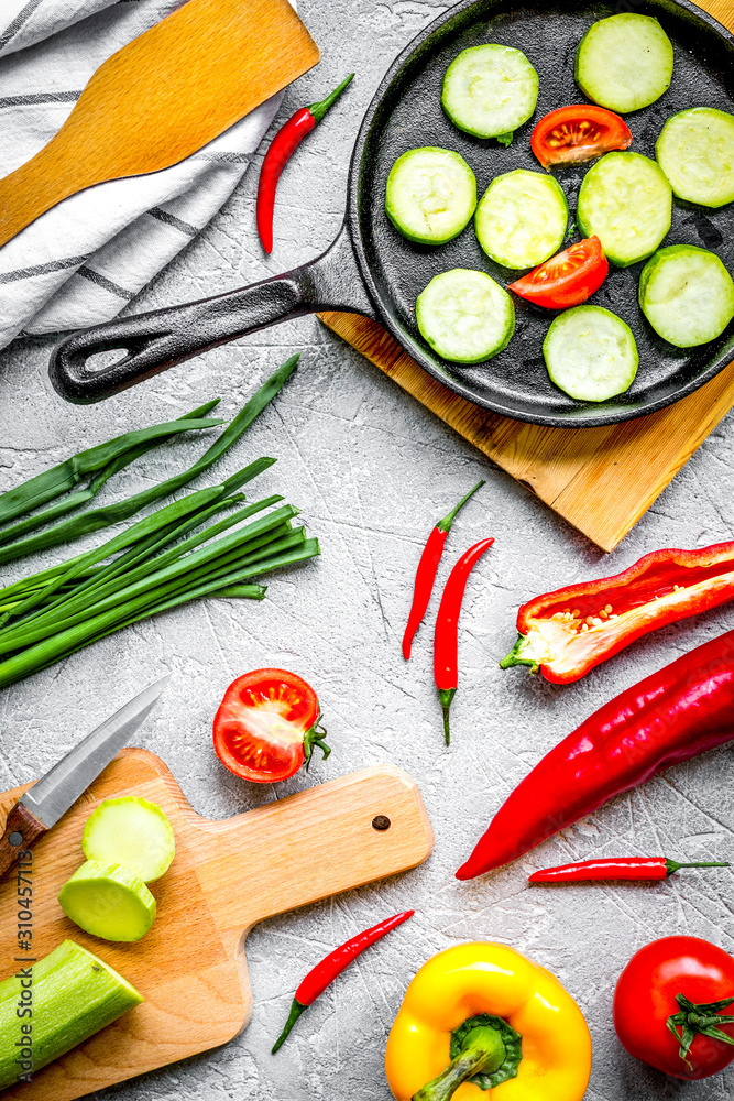 cooking vegetables on the stone background top view