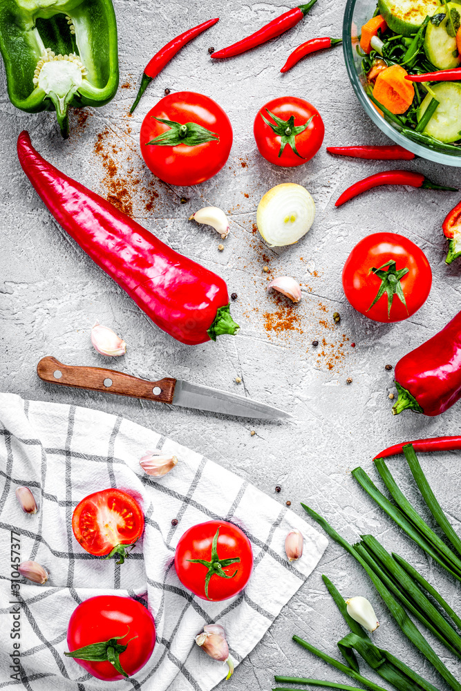 cooking vegetables on the stone background top view