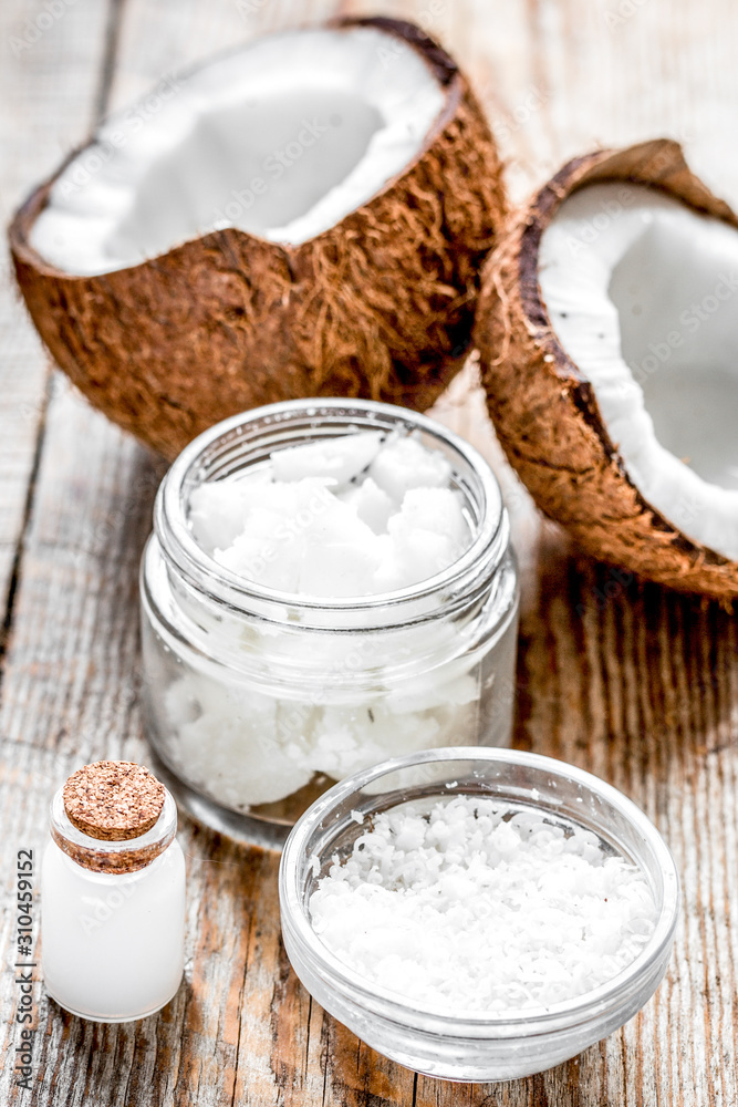 cosmetic concept with fresh coconuts on old wooden table background