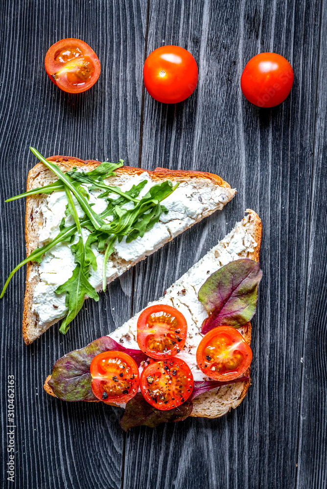 fitness breskfast with homemade sandwiches dark table background top view