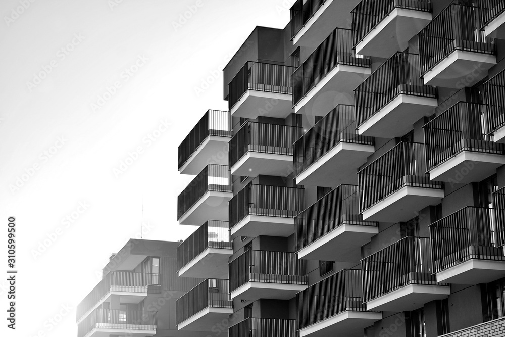 Sun rays light effects on urban buildings. Fragment of modern residential apartment with flat buildi