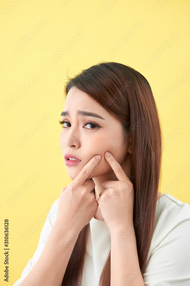 woman who checks her skin. acne treatment