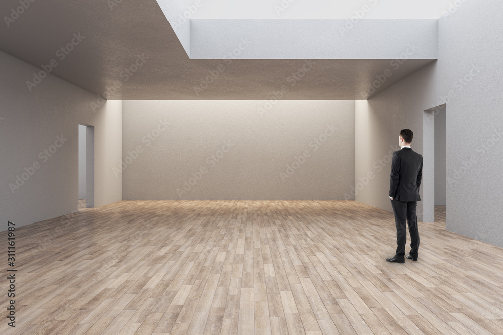 Businessman in minimalistic gallery interior