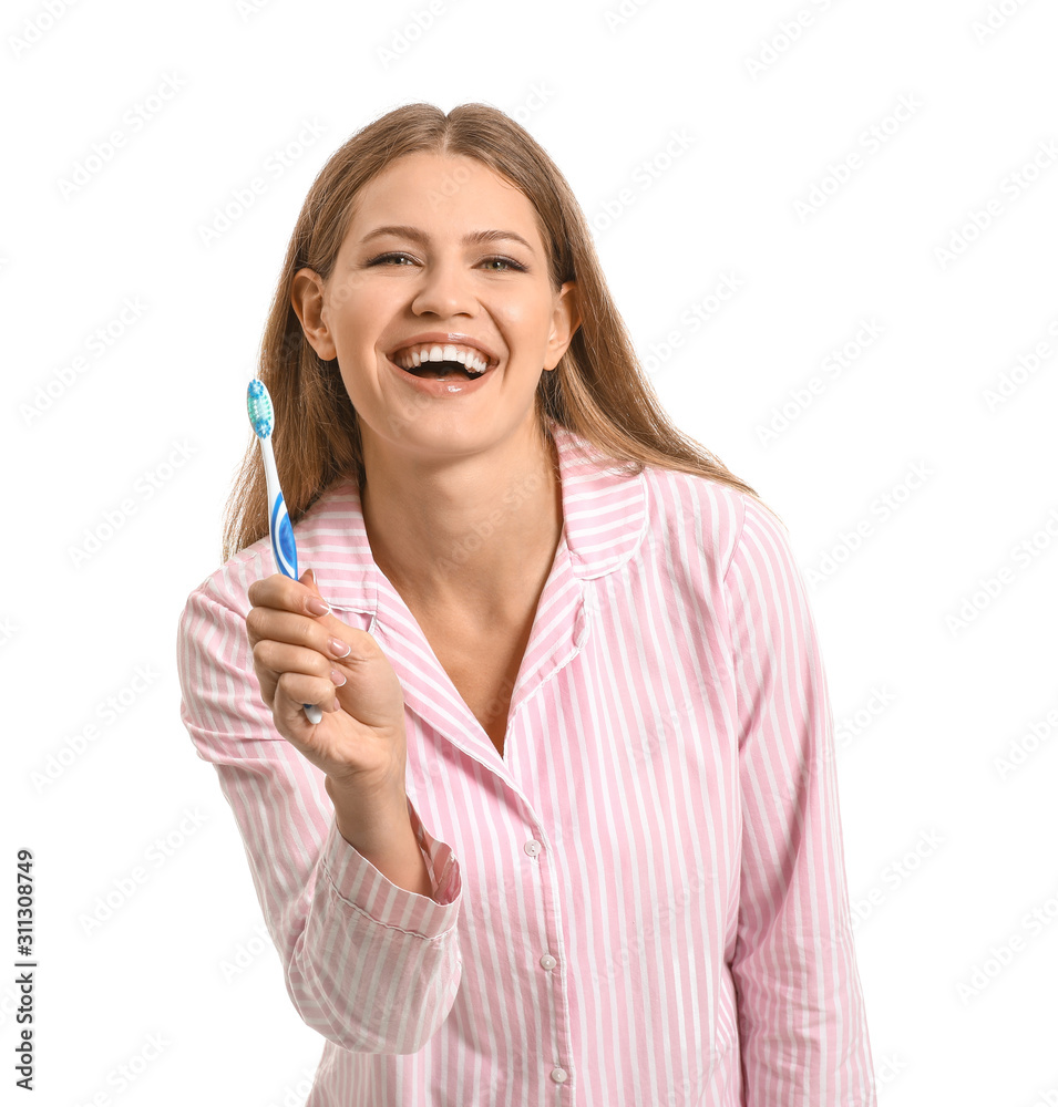 Young woman with toothbrush on white background