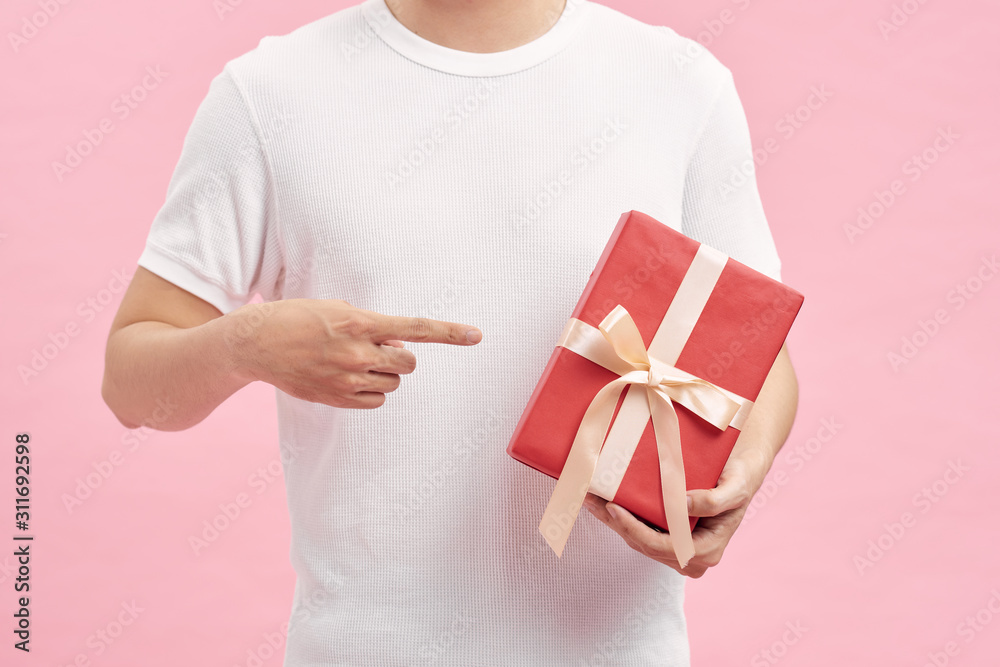 Man with white t-shirt holding gift boxes in hands