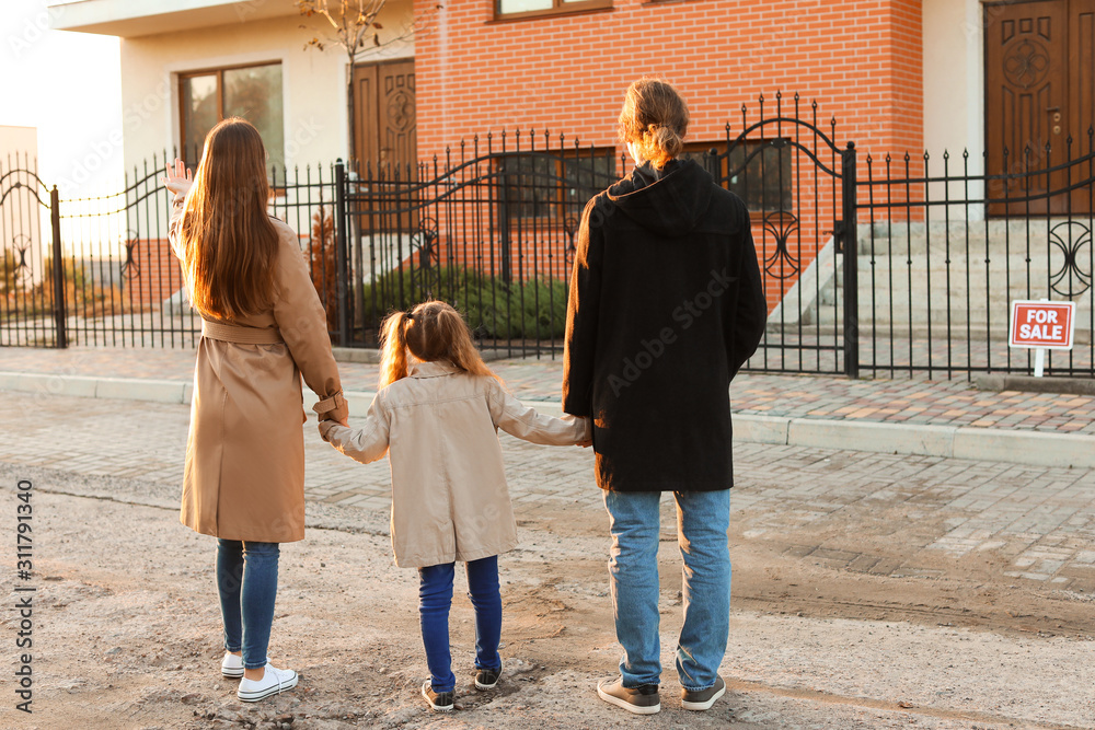 Young family near their new house