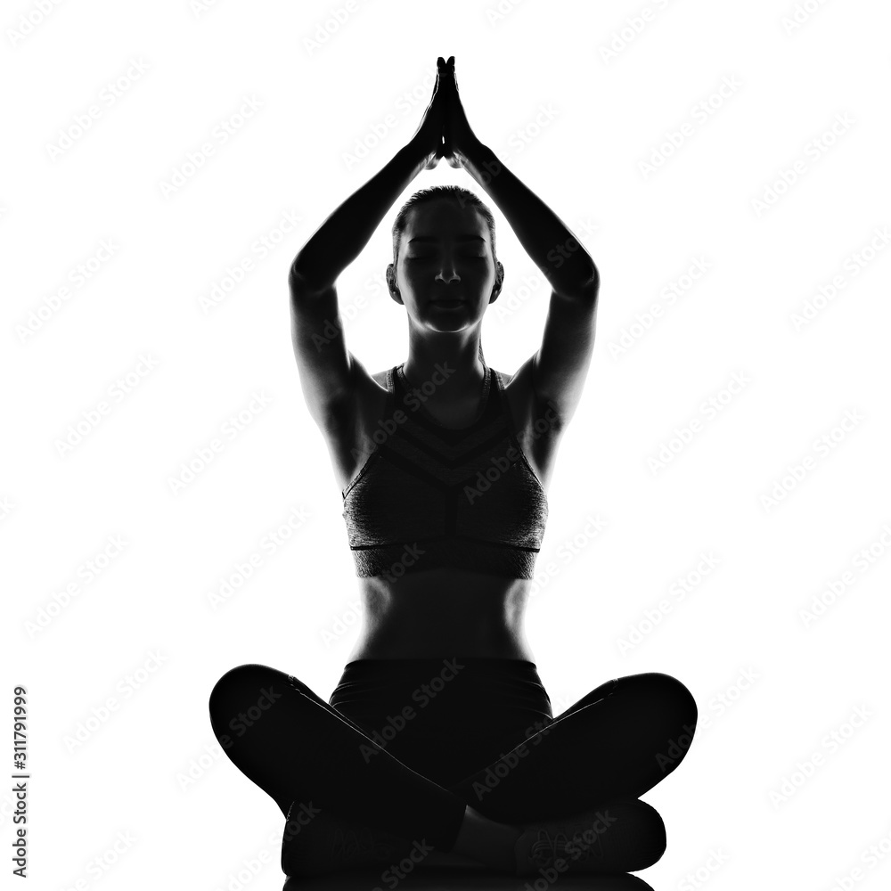 Silhouette of sporty young woman practicing yoga on white background