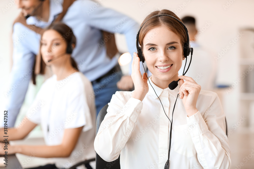 Female technical support agent working in office