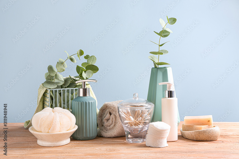 Set of bath accessories on wooden table