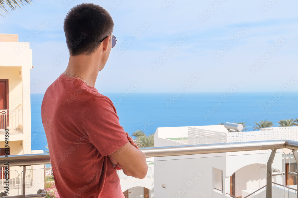 Young man at tropical resort